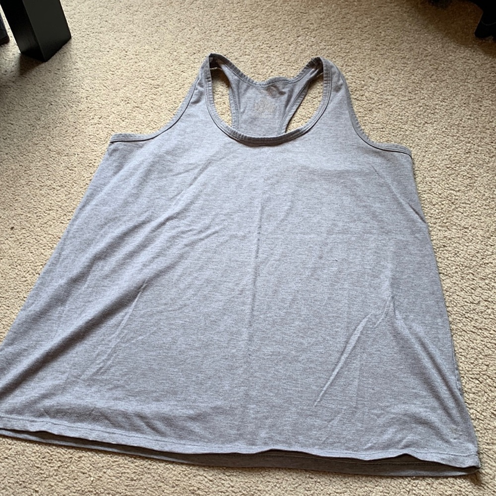 Light grey, sleeveless tank top.